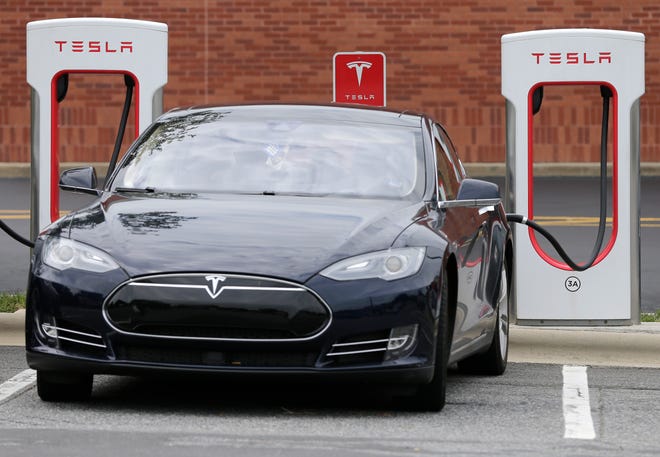 A Tesla electric car charging on July 7, 2017, in Charlotte, North Carolina.