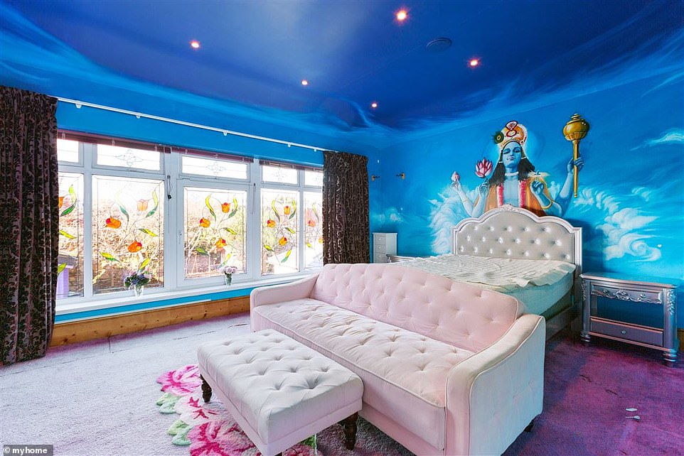 He's watching over you!u00A0One of the bedroom's also features Sinu00E9ad's homage to the Hindu god Vishnu on a blue sky backdrop, with the mural overlooking one of the home's enormous double beds