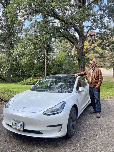 Peter Holle with his electric car. (Submitted)