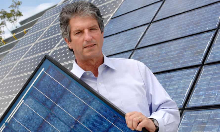 University of NSW solar photovoltaic researcher Martin Green holds a solar panel