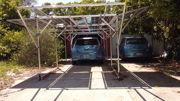 Car under GismoPower solar carport at the Ginsberg-Klemmt residence.