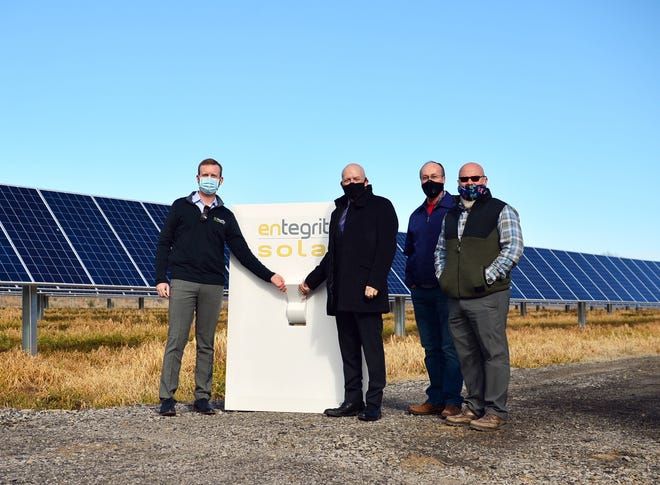 Entegrity's Sam Selig, left, is seen with Alma Mayor Jerry Martin, Alma Public Works Director Mark Yardley, and District 5 Justice of the Peace Raymond Harvey at the city's Flip the Switch event on Feb. 5. The event commemorated powering on Alma's new solar array. The city is on its way to completing its solar project after unforeseen issues.