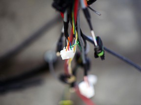 Wires hang from an electric truck inside the Canadian Electric Vehicles Ltd. manufacturing facility in Parksville, British Columbia.