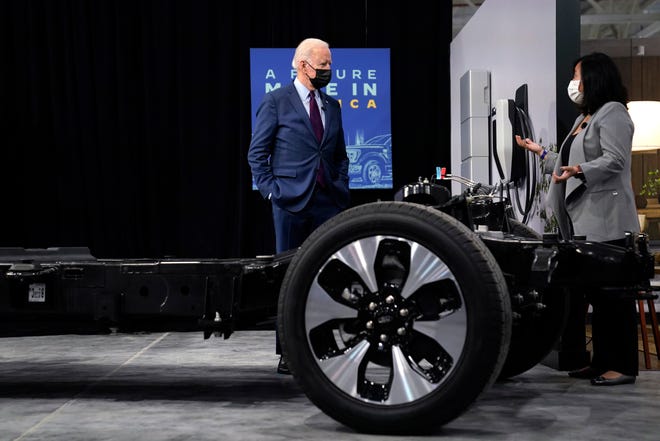 President Joe Biden listens during a tour of the Ford Rouge EV Center on May 18, 2021, in Dearborn. He is talking to Linda Zhang, chief engineer of the all-electric Ford F-150 Lightning.