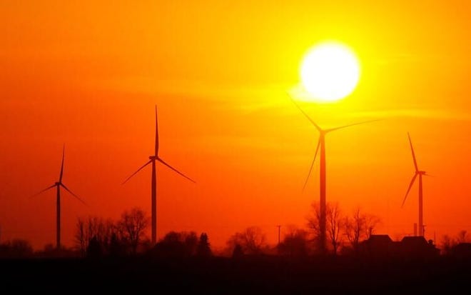 The sun sets over the Wildcat wind farm north of Elwood in this file photo. E.ON Climate and Renewables built the facility in Madison and Tipton counties. (The Herald Bulletin file photo)