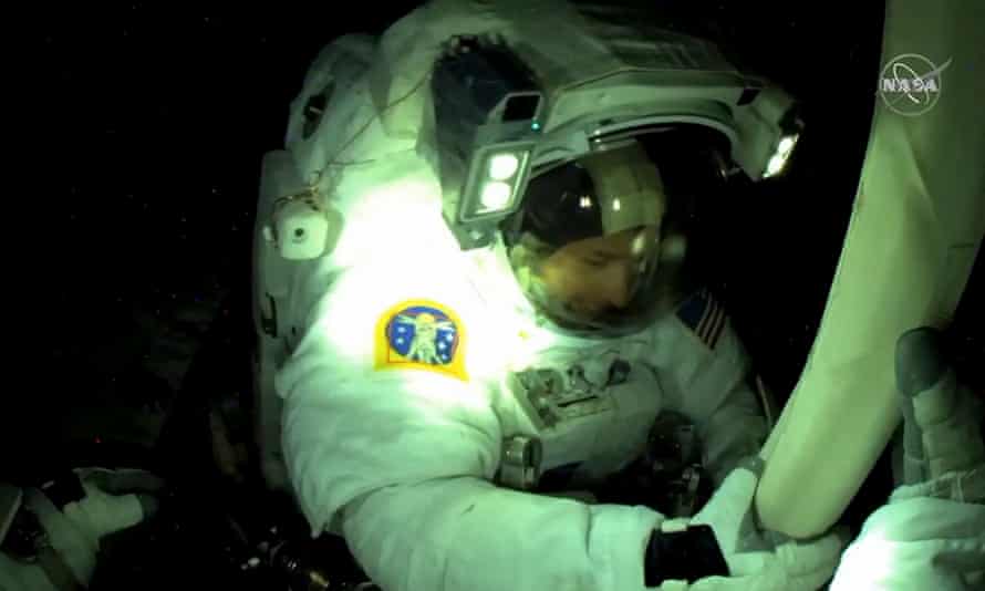 US astronaut Shane Kimbrough seen from European Space Agency astronaut Thomas Pesquet’s helmet camera, fixing bolts, during unfolding and alignment of the solar panel.