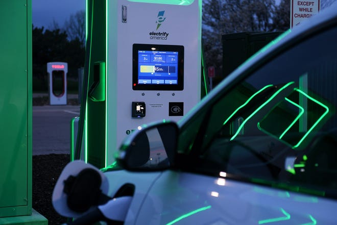 A vehicle charges at the Electrify America electric vehicle charging station at the Meijer store in Roseville on April 19, 2021.