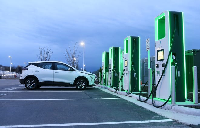 A vehicle charges at the Electrify America electric vehicle charging station at the Meijer store in Roseville, Mich. on April 19, 2021.