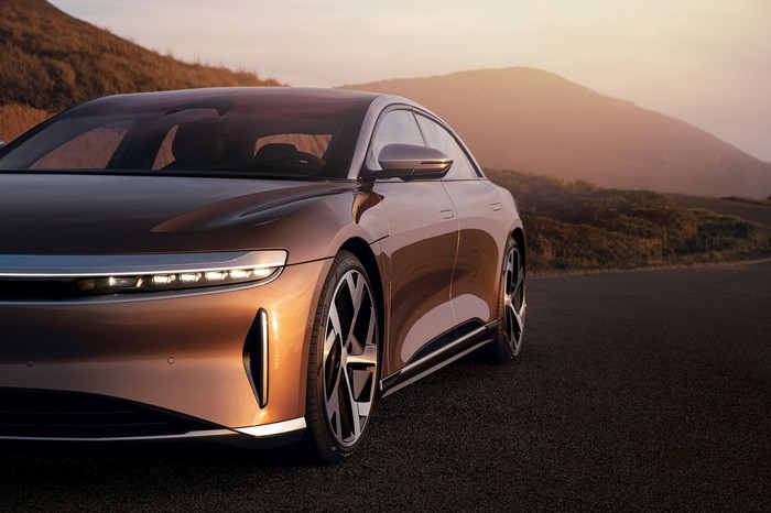 The Lucid Air in front of a mountain landscape.