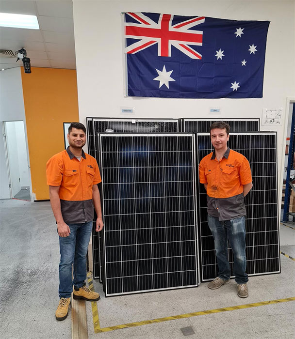 Tindo Solar workers with some of the last panels produced on the old assembly lines. (Supplied)