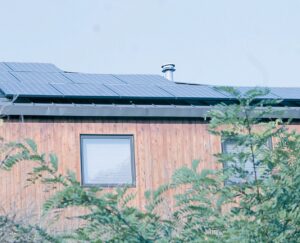 Right: Some of the 29-panel solar array are attached to the eastward facing roof of this Porter house. Other panels are installed on the opposite side. LOIS TOMASZEWSKI/photos