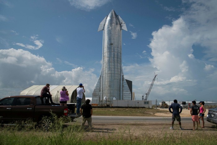 Space enthusiasts view a prototype of SpaceX’s Starship spacecraft at the company’s Texas launch facility in Boca Chica near Brownsville, Texas