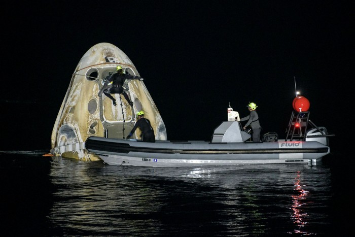 Support teams work around SpaceX’s Crew Dragon Resilience spacecraft shortly after it landed in the Gulf of Mexico in May 2021