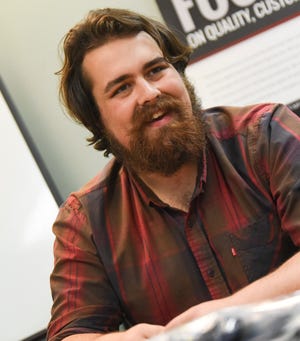 Tom Skahen, CEO of Opus Motorcar Company, smiles during an interview Wednesday, Oct. 13, 2021, in St. Joseph.