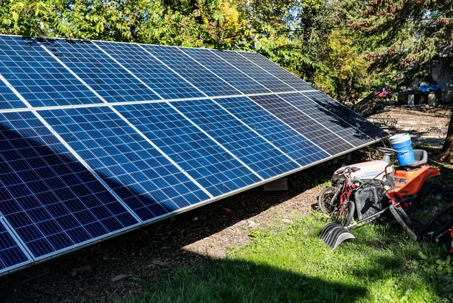 Ground solar panels sit in the backyard of Tammy Black's home in Jefferson Chalmers neighborhood of Detroit on Oct. 20, 2021. Community Treehouse Center Detroit is fulfilling its plan to install solar panels into 25 homes in the Jefferson Chalmers neighborhood. The organization has made it possible for Detroit residents, like Black, to receive an affordable solar energy option with a buy-in of $2,000, with the organization covering the rest. The plan is called the Global Treehouse Initiative 2.