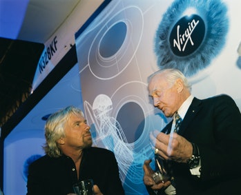 Virgin boss Sir Richard Branson and former Apollo (11) astronaut Buzz Aldrin chat after Virgin Galac...